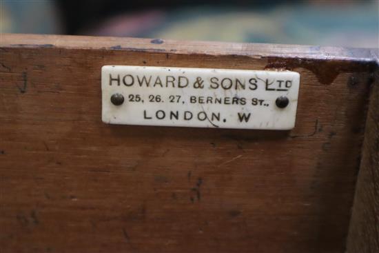 A late Victorian oak pedestal desk, bears Howard and Son stamp and plaque, together with a contemporary black W.150cm
